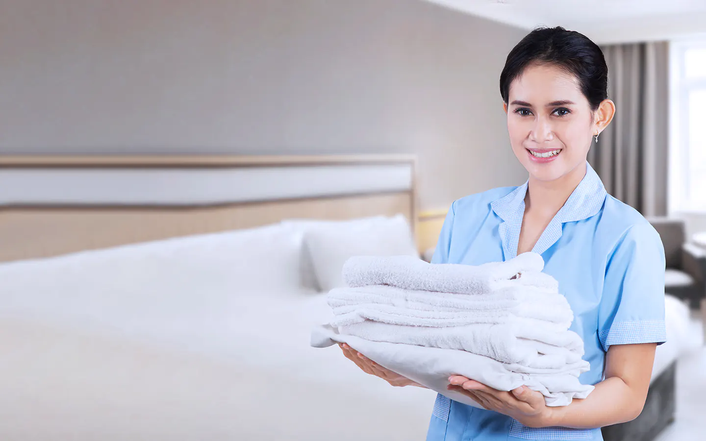Maid holding towels